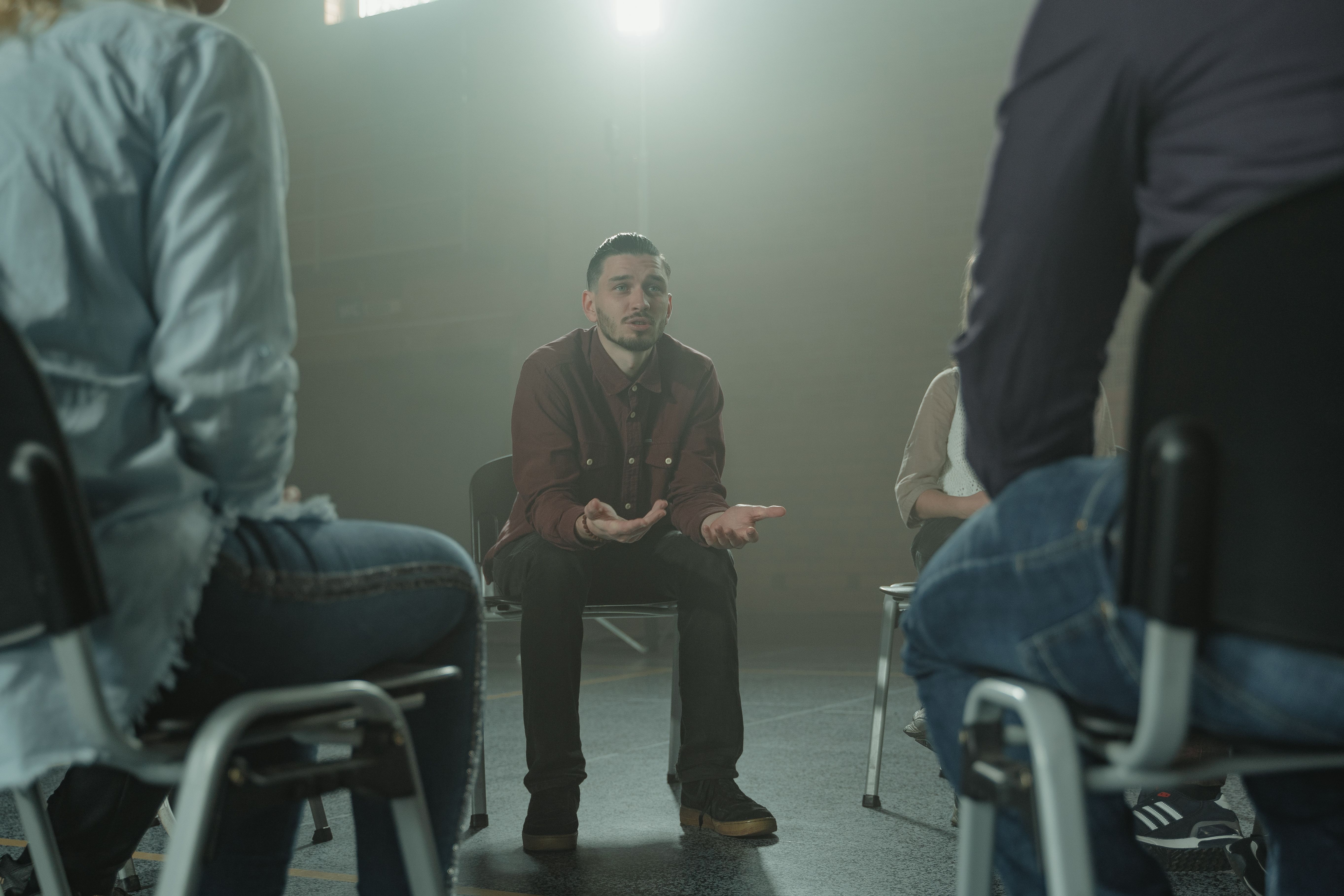 A man sharing during a group support session